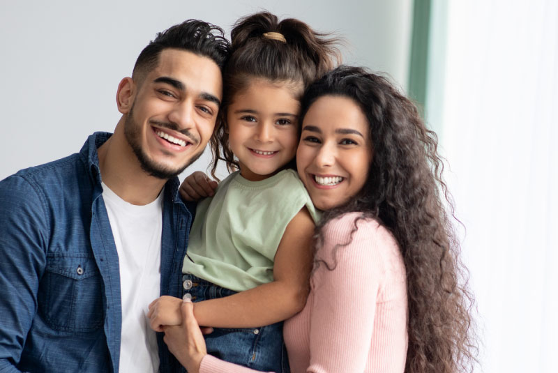 Smiling family planning and saving for future milestones with a money market account