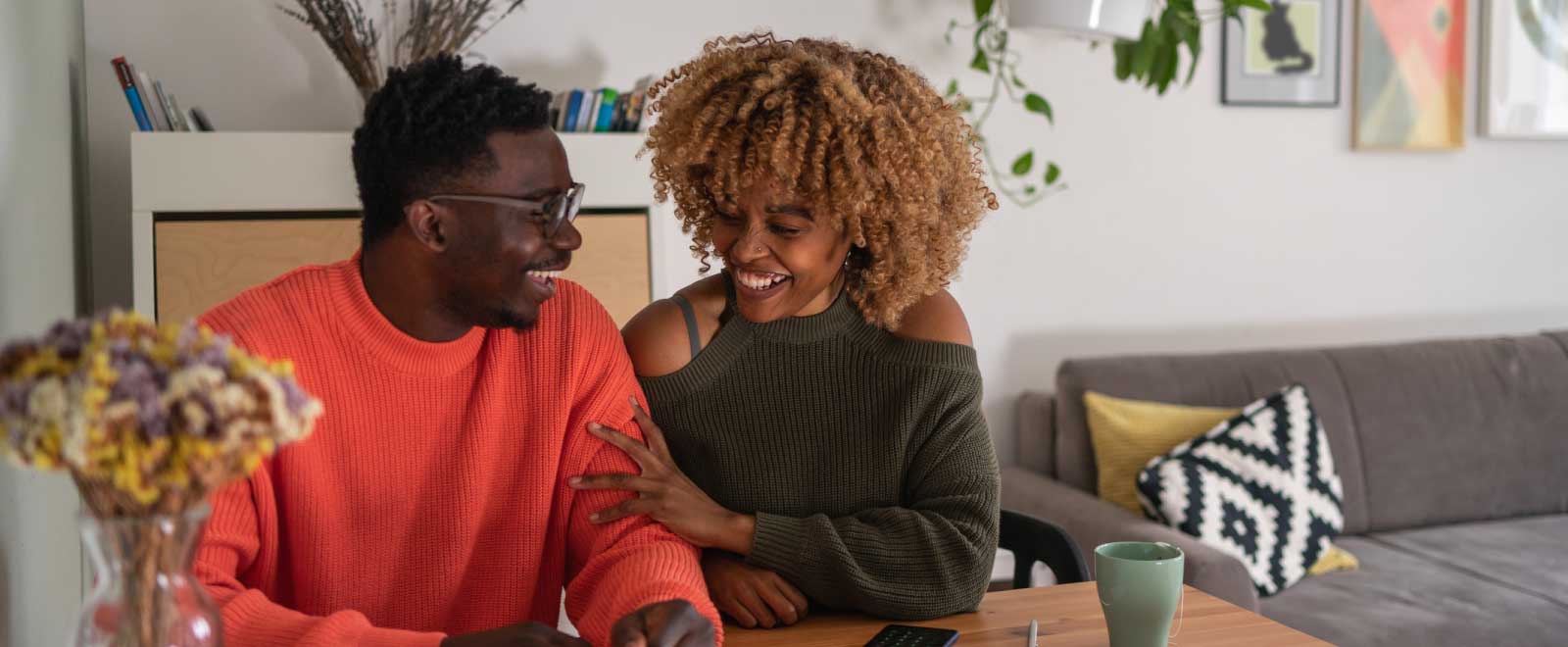 Couple sitting together and laughing
